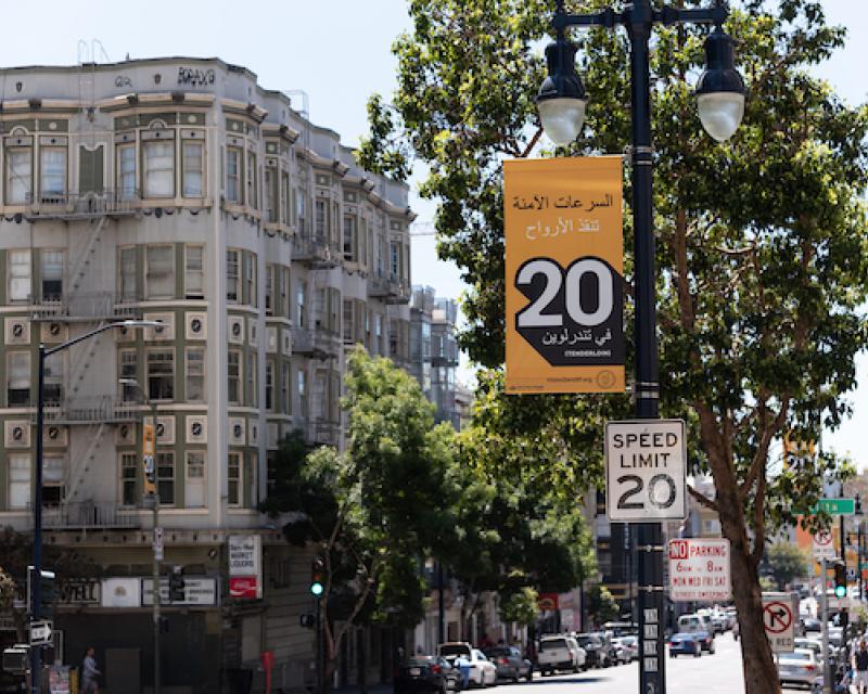 New 20 miles per hour speed limit sign with large poster highlighting the new speed for drivers 
