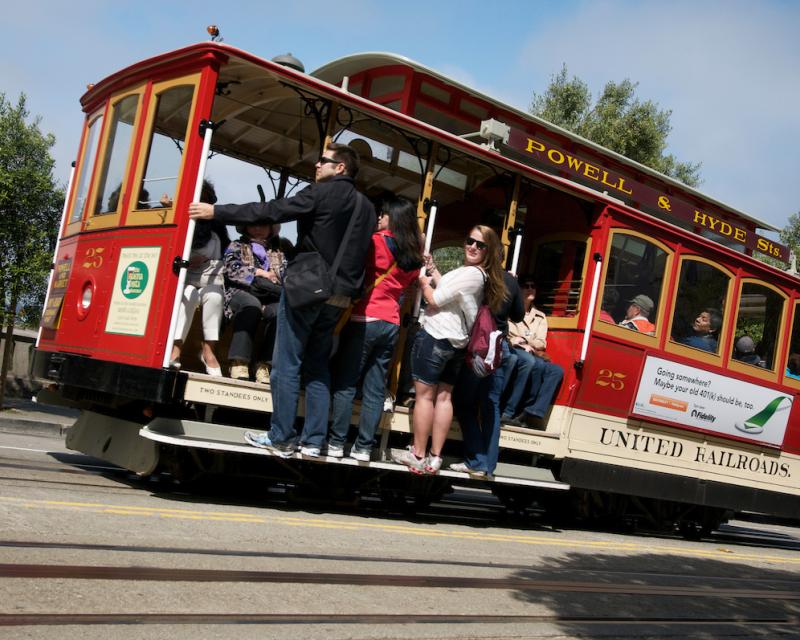 Cable car riders travel uphill
