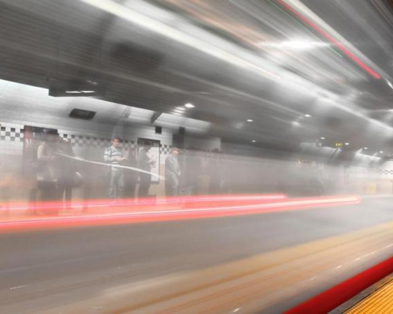 Blurred image of passing Muni train in a metro subway 