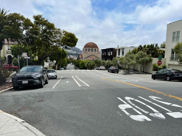 Image of Arguello boulevard with cars parked on either side.