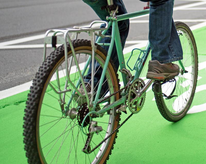 Green bike lane in San Francisco with bicyclist