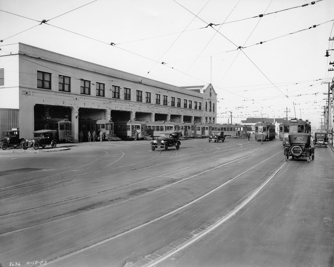 streetcars and automobiles outside geary carhouse