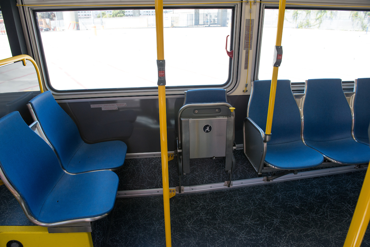 Photo of dedicated wheelchair space on New Flyer buses.