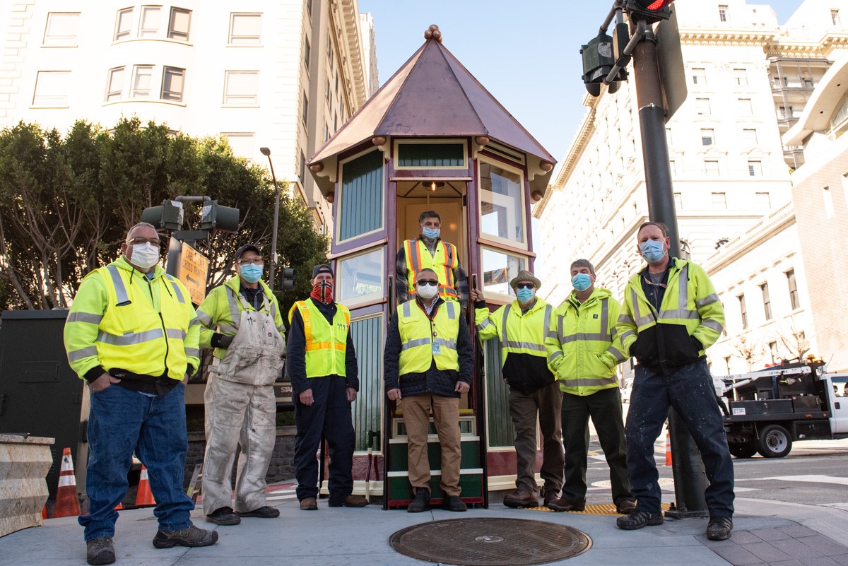A group photo of Muni craftspeople and shop management who worked to restore the signal tower in 2020-2021.