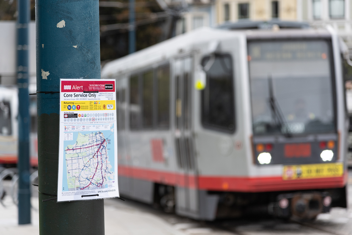 photo of N Judah train with temporary sign indicating stop changes
