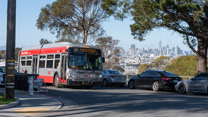 A 15 Bayview Hunters Point Express coach passes a city vista along Jerrold Ave in the Hunter’s Point neighborhood on January 25, 2021.