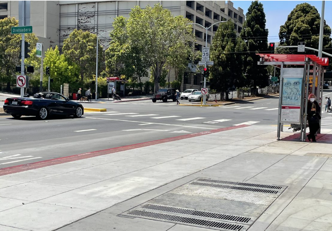 Photo: Newly installed pedestrian refuges and widened bus bulb along Geary Boulevard at Divisadero.  