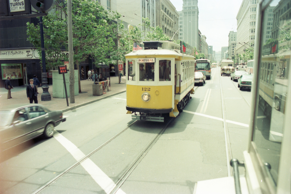 Vintage photo of Streetcar 122 from Portugal on city streets.