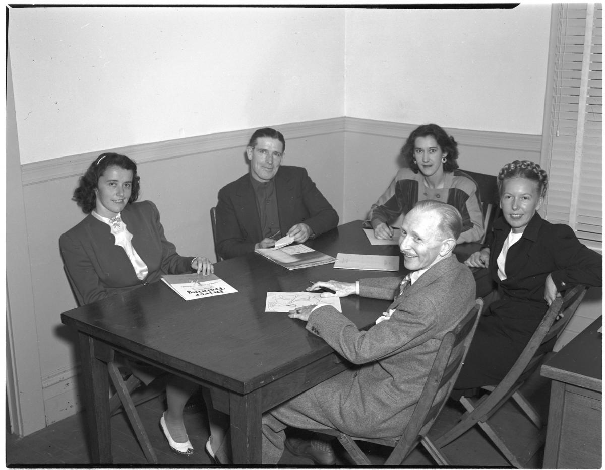 Group photo of Trolley Topics contributing staff in 1946. Clockwise from left: reporters Dolores Shea, Robert Fish, Maybelle Paetzel, editor Adeline Svendsen, and cartoonist Charles Reed.