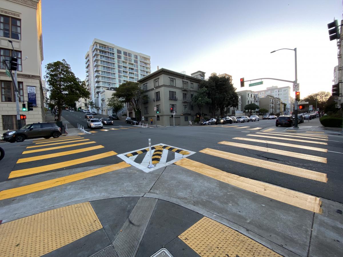 Intersection of Franklin Street and Broadway with refreshed high-visibility crosswalks and slow-turn wedges