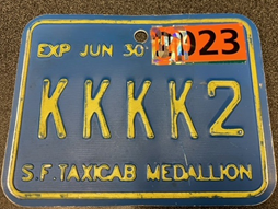 Medallion with an expired 2023 sticker