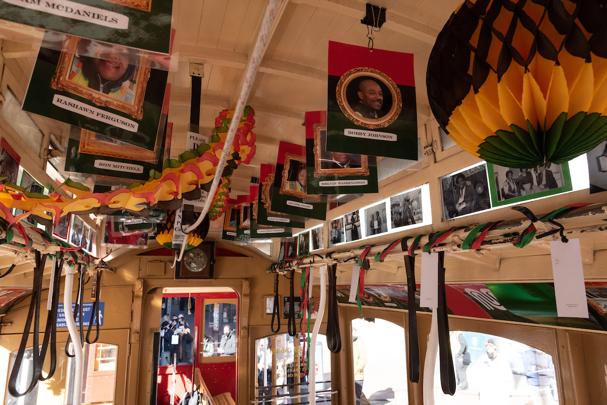 Photos and paper decorations inside a cable car.