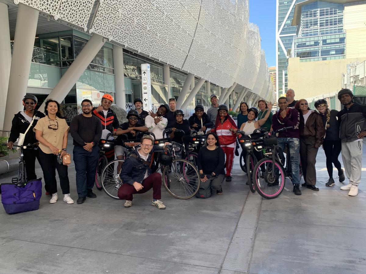 Fillmore residents with bikes standing in front of the Salesforce Transit Center