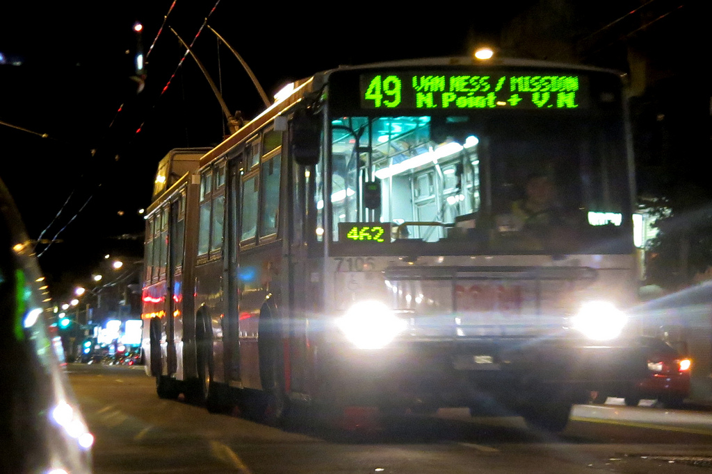 Front of 49 Van Ness/Mission trolley bus on the street at night