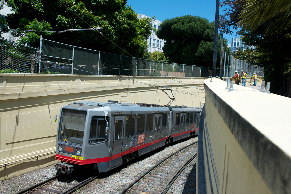 N Judah light rail vehicle traveling west out of the Sunset Tunnel in Cole Valley.