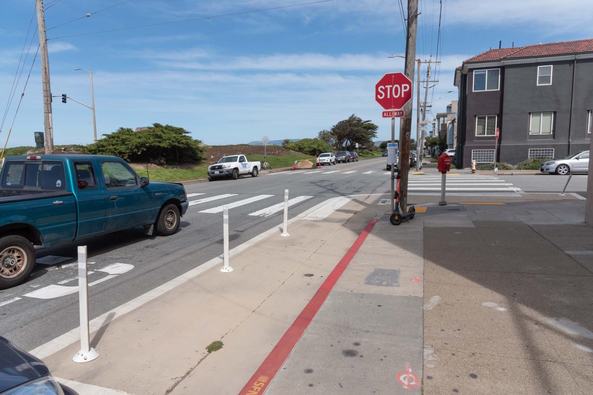 A red curb and stop sign