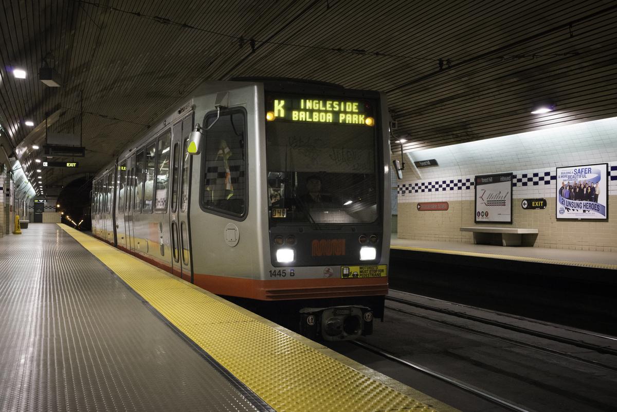 K Ingleside streetcar at Forest Hill Station platform with yellow tactile warning strip.