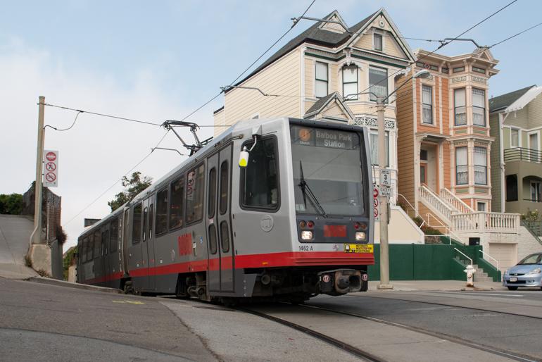 Muni LRV streetcar passing Victorian houses on 21st and Chattanooga streets in Dolores Heights.