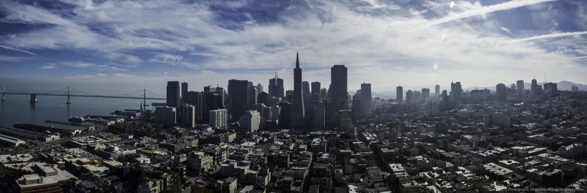 Panoramic view of San Francisco downtown skyline and Bay Bridge from Coit Tower