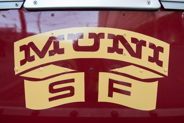 Muni Ribbon Logo in yellow and maroon on restored GMC Coach 3287 bus