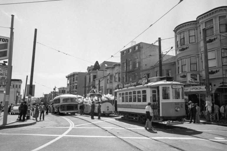 Historic streetcars and buses lined up on 17th Street during the 1983 Trolley Festival in San Francisco.