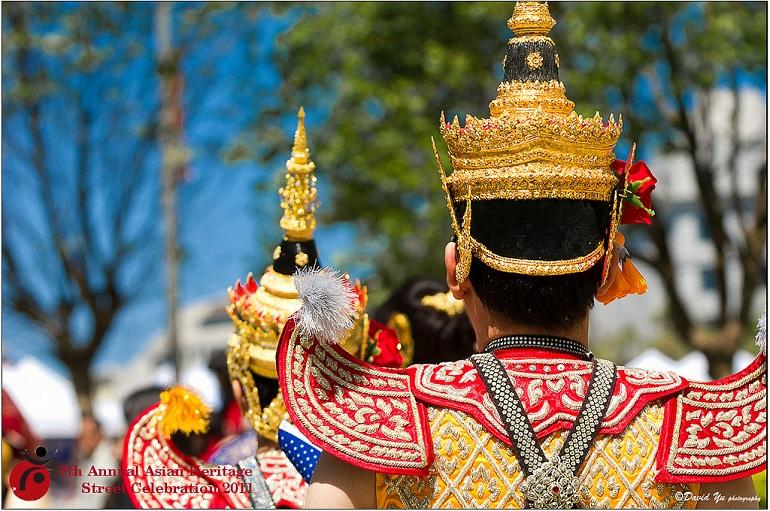 Thai dancer in gold and red ceremonial costume at Asian Heritage Street Celebration