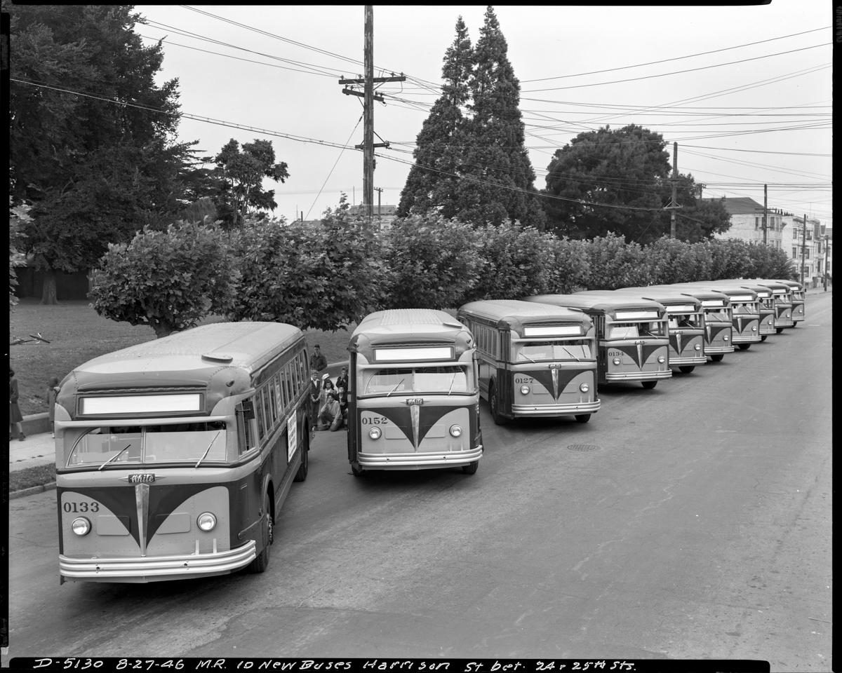 Row of new White Motor Coach buses parked on Harrison Street, San Francisco, 1946.