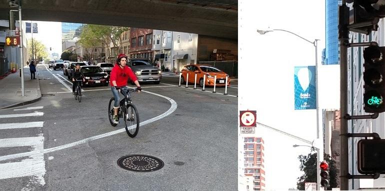 Cyclist in red jacket riding through urban intersection under highway overpass with traffic signal visible