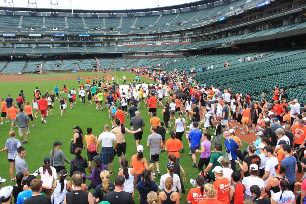 Hundreds of runners gather on the field at AT&T Park for the Giant Race event.