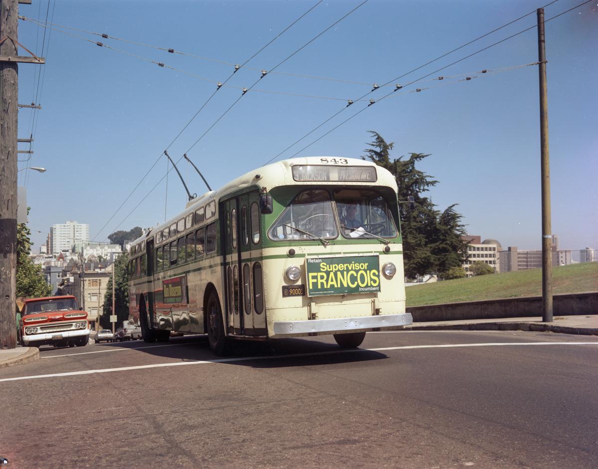 Vintage trolley coach number 843 on the 3 Jackson line, 1967, connected to overhead electric wires.