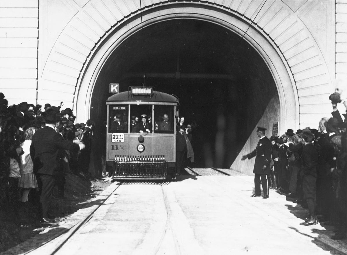 Streetcar 117 emerging from Twin Peaks Tunnel with Mayor Rolph and crowds, 1918