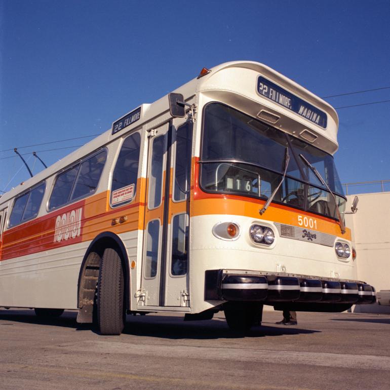 Muni Trolley Coach 5001 with new orange and white paint scheme and worm logo, 1975