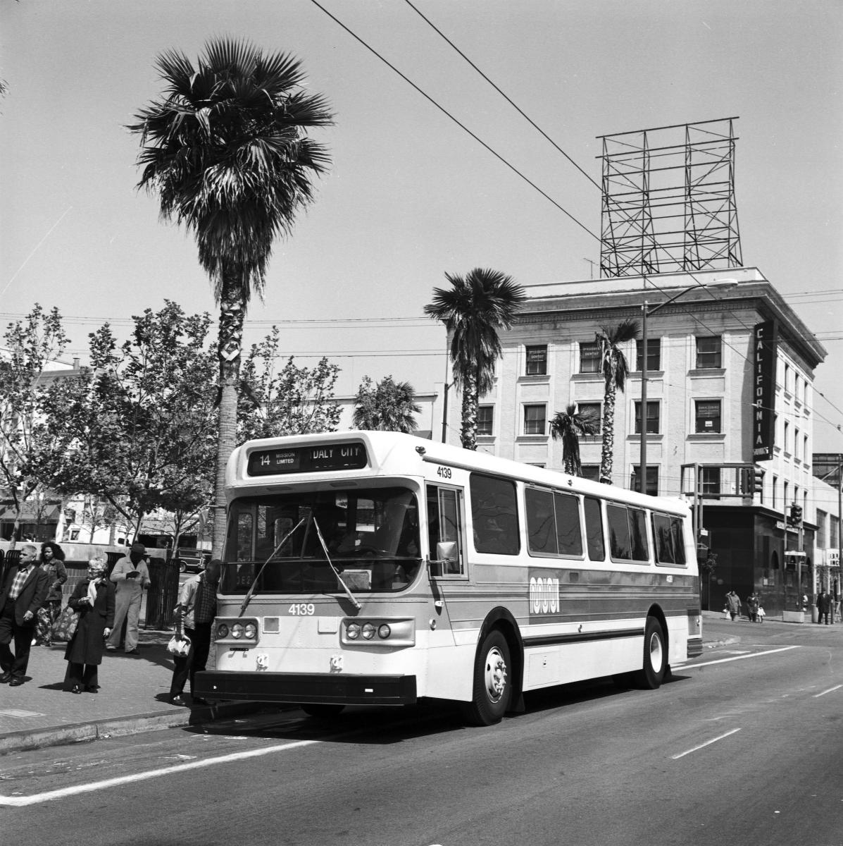 Vintage bus number 4139 stopped at Mission and 16th Streets with passengers boarding, palm trees and historic buildings visible in background.