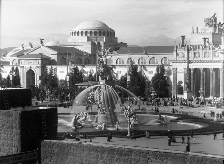 Fountain of Energy at the 1915 Pan-Pacific Exposition main entrance with classical buildings and cypress trees.