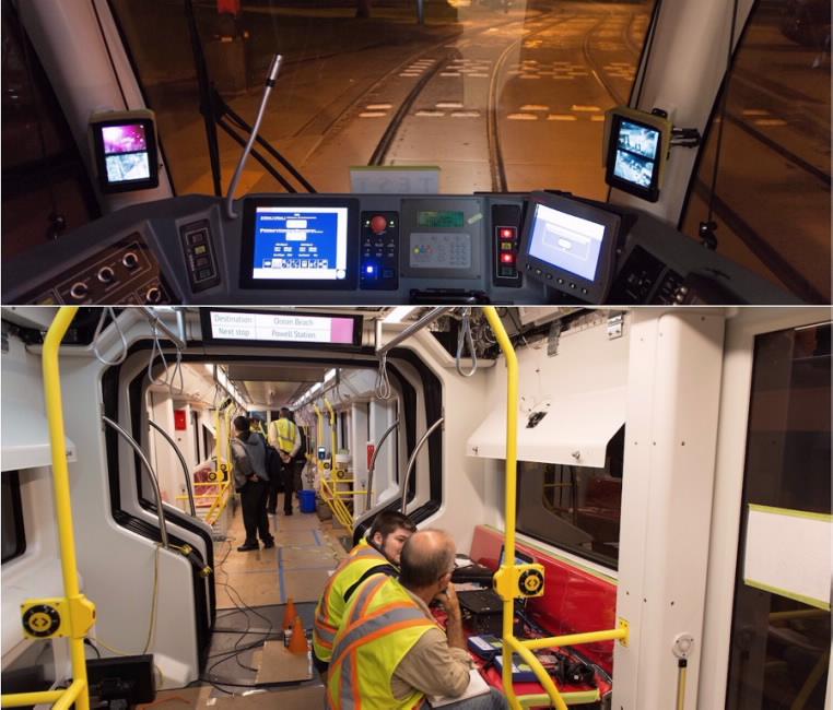 Operator cab controls and displays on test train; engineers and staff inside train car during maintenance testing.