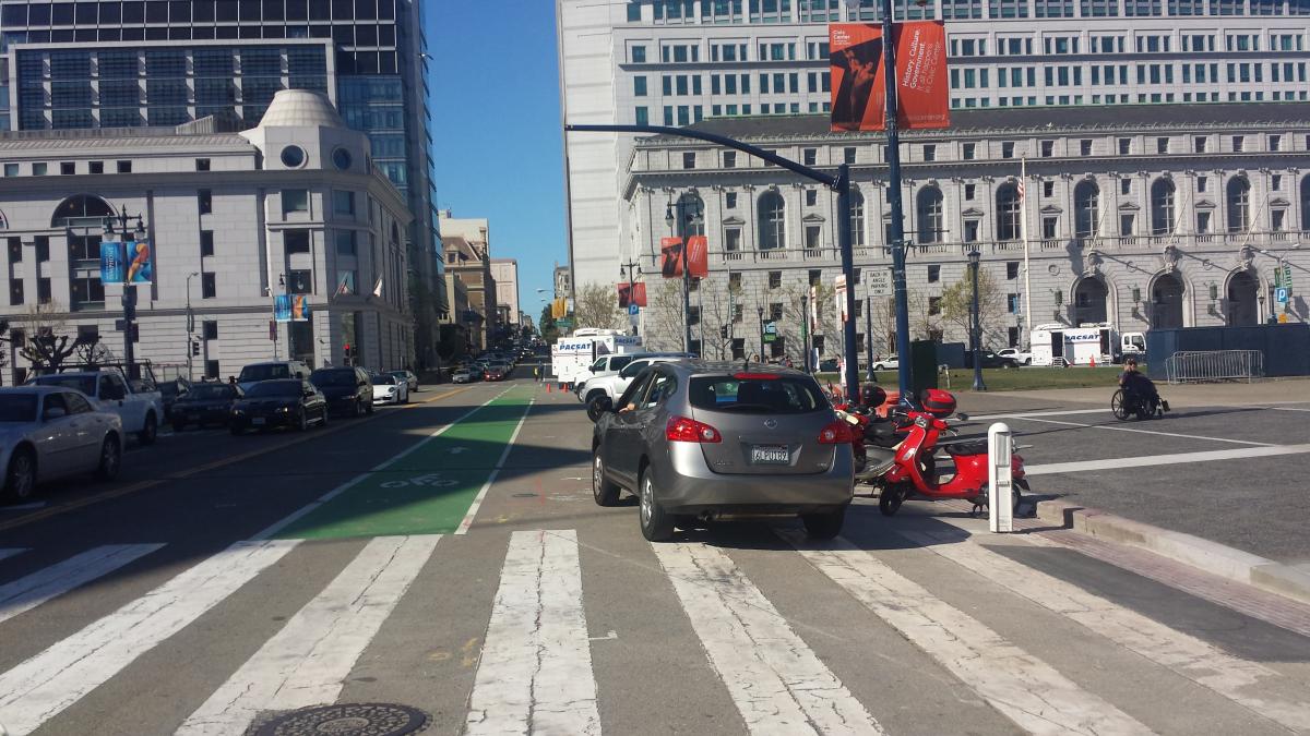 Northbound traffic signal mast arm on east side of Polk Street north of City Hall crosswalk at Civic Center Plaza.