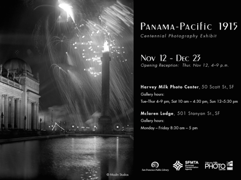 Black and white nighttime photograph of Panama-Pacific International Exposition 1915 with illuminated tower and fireworks reflected in water.