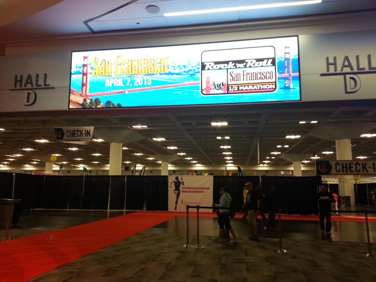 Hall D entrance at Moscone Center with red carpet and digital signage for San Francisco Half Marathon Expo, April 2013.