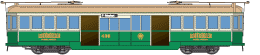 Green and cream colored vintage streetcar with multiple windows and doors, shown from the side.