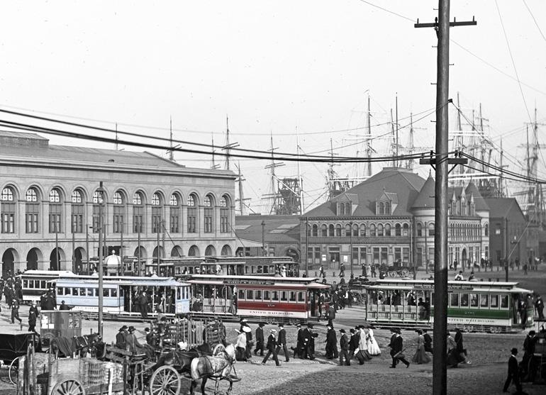 Historic Market Street scene with cable cars, horse-drawn wagons, and Victorian buildings, circa 1905.