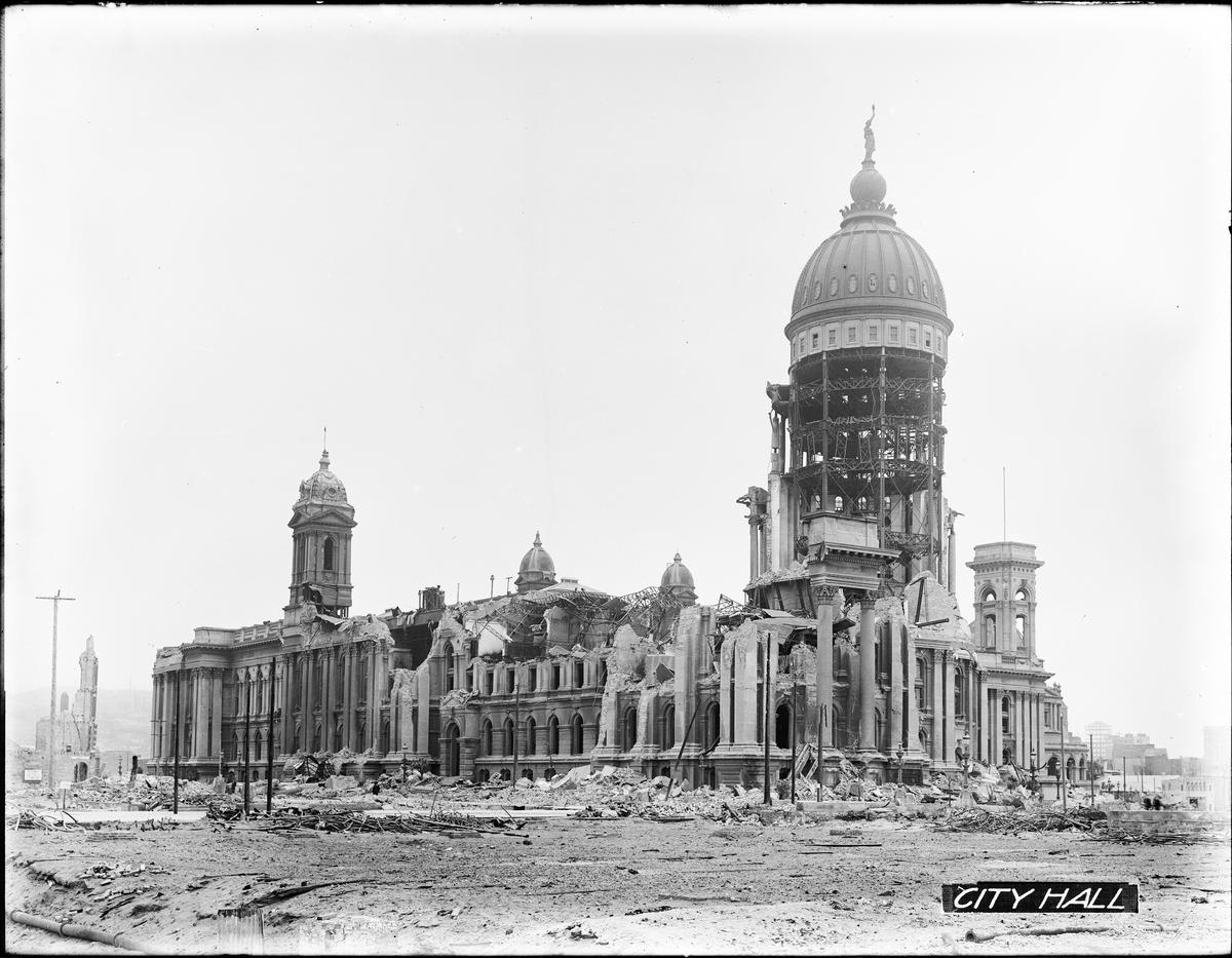 Damaged City Hall building with dome still standing amid rubble and debris, 1906.