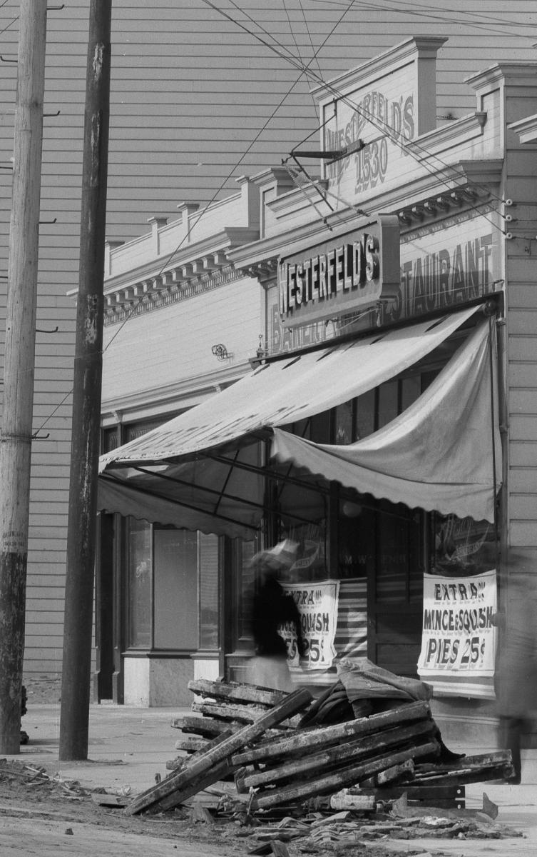 Westerfeld's Bakery storefront with streetcar tracks overhead, 1906