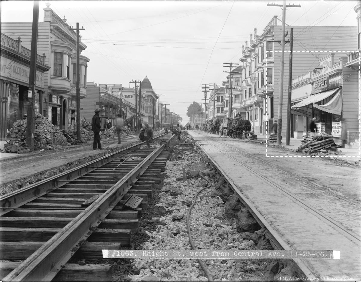 Streetcar tracks under construction on Haight Street, San Francisco, 1906, with period buildings lining both sides.