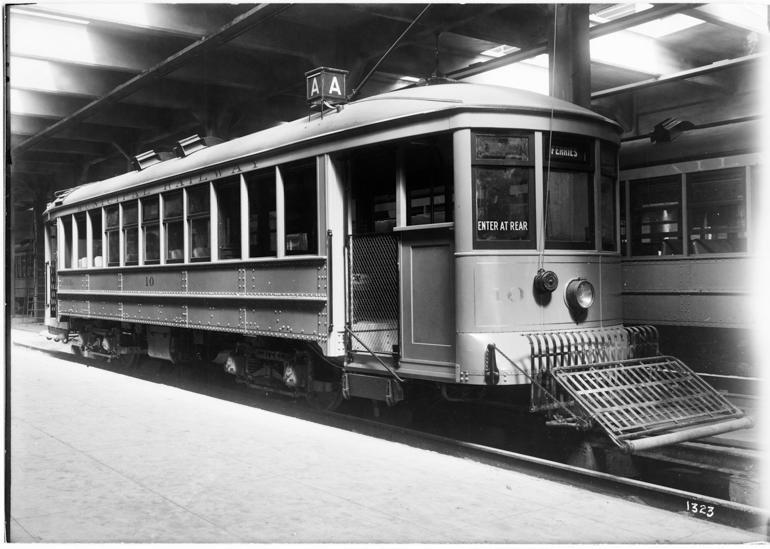 A-Type Streetcar 10 parked in Geary Carhouse with "Enter at Rear" sign visible on side.
