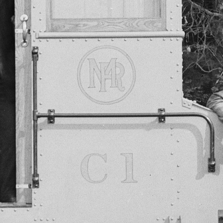 Close-up of painted MR logo and C1 designation on side of streetcar, 1916