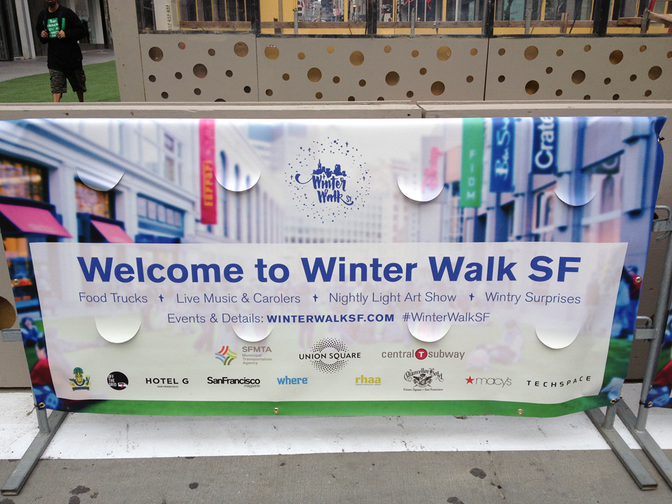 Welcome to Winter Walk SF banner on street with sponsor logos and event details