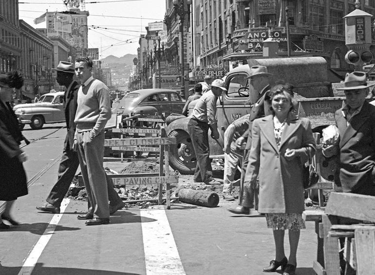 Pedestrians navigate street construction at Market and Stockton streets, 1947