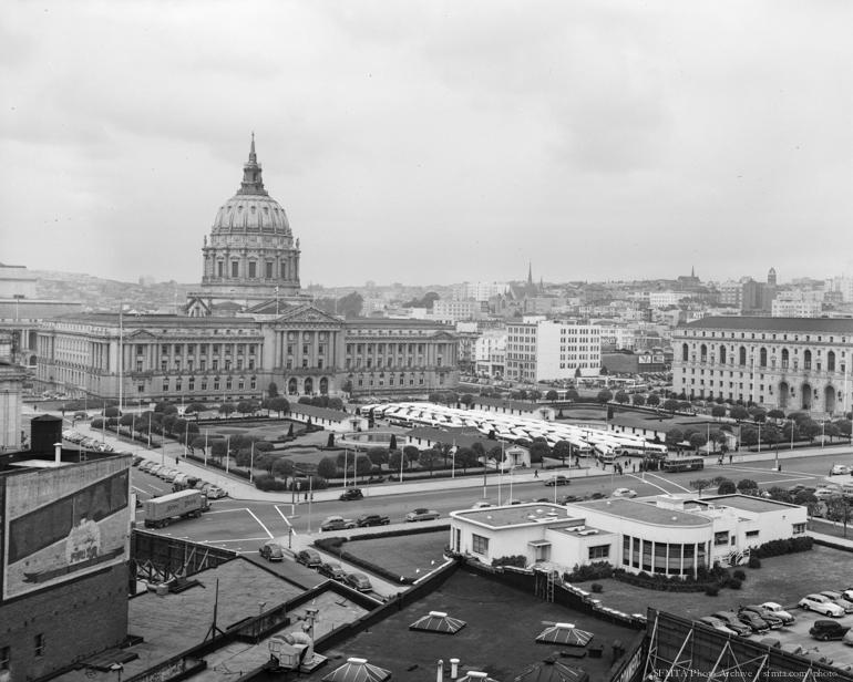 55 new White Motor Coaches lined up at Civic Center Plaza with City Hall dome in background, 1948