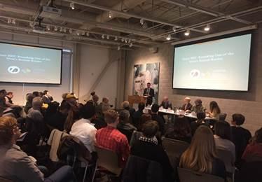 Panelists discuss Geary BRT project at SPUR forum with audience seated in auditorium.