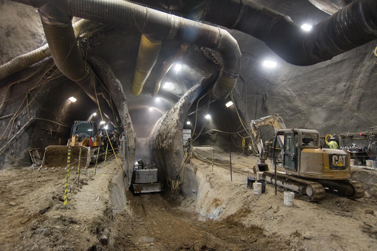 Construction equipment excavating underground tunnel for Central Subway project in San Francisco.